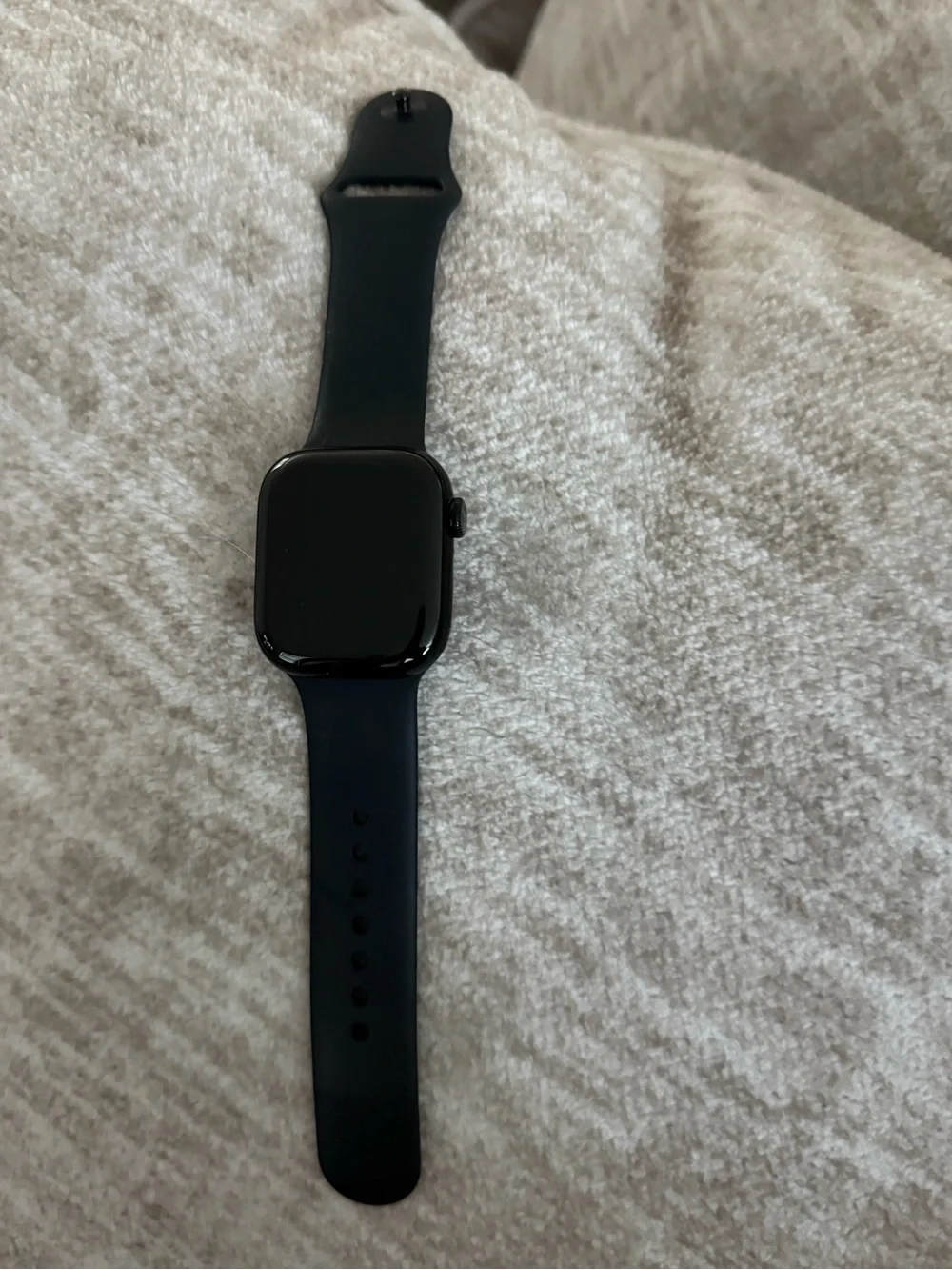 Apple Watch Series 11. GPS. 44mm Jet black aluminum case with black sport band.